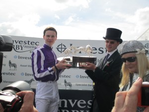Joseph O'Brien and his father, trainer Aidan O'Brien lift the trophy after winning the 2014 Investec Derby with Australia.