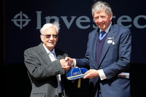 Epsom racecourse chairman Anthony Cane presents Lester Piggott with the first Investec Derby cap.