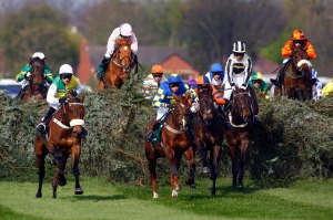 Ballabriggs and Jason Maguire jumping the chair (yellow and green and white) winning The John Smith's Grand National  Pic: Dan Abraham - racingfotos.com 