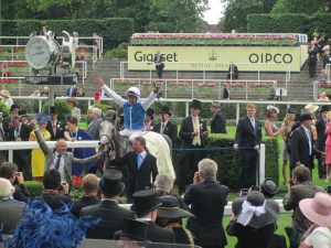 Maxime Guyon celebrates after winning the Queen Anne Stakes on Solow.