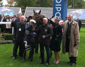 Dermot Weld (right) and winning connections after the victory of Forgotten Voice in the Qipco Champion Stakes.